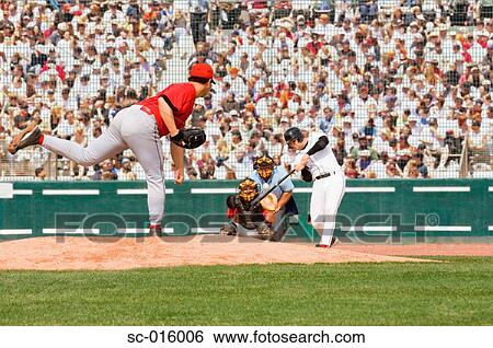 Stock Photograph - Baseball player hitting a pitch. Fotosearch