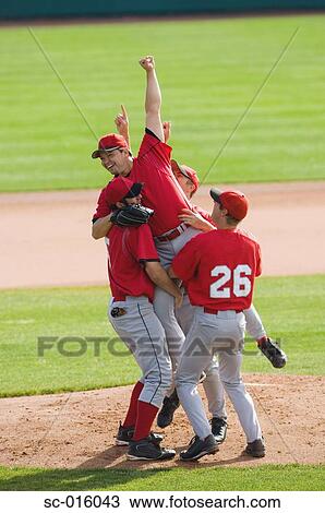 Baseball player lifting the pitcher View Large Photo Image Stock Image - Baseball player lifting the pitcher. Fotosearch