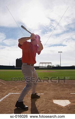 Stock Photograph - Baseball player perfecting his stance. Fotosearch