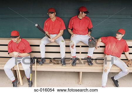 Picture - Baseball players in a dugout. Fotosearch
