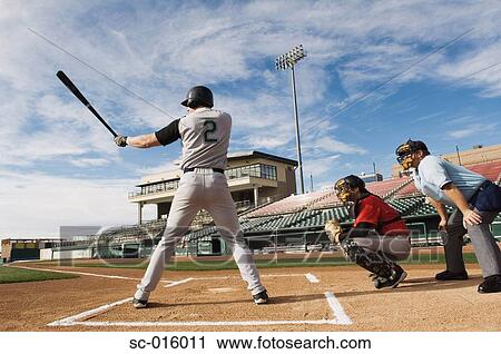 Stock Image - Batter at home plate. Fotosearch