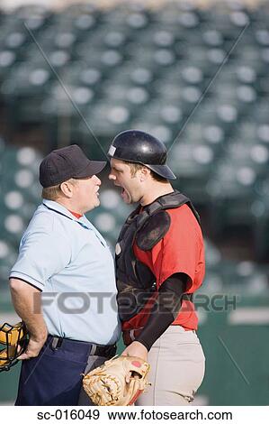 Stock Photo - Catcher arguing with Umpire. Fotosearch