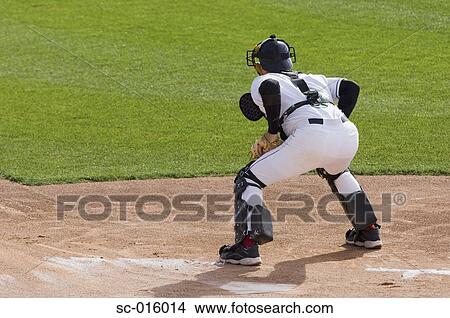 Picture - Catcher ready for the throw into home. Fotosearch