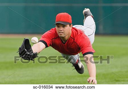 Diving catch View Large Photo Image Picture - Diving catch. Fotosearch