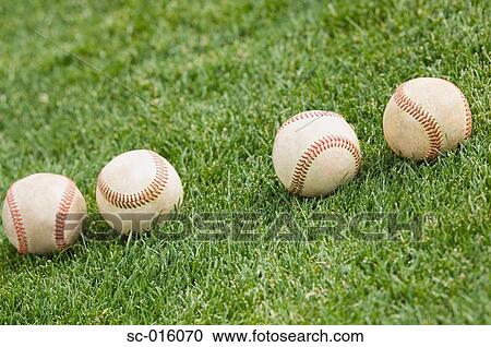 Four baseballs on grass View Large Photo Image Stock Image - Four baseballs on grass. Fotosearch