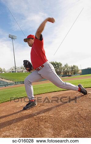 Stock Photo - Pitcher pitching. Fotosearch
