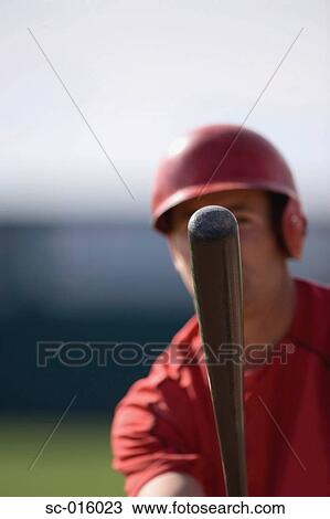 Stock Image - Player and his bat. Fotosearch