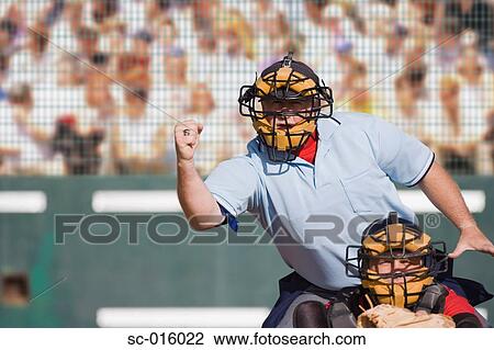 Stock Image - Umpire calling a strike. Fotosearch