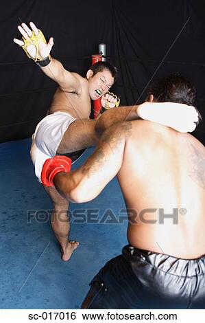 Stock Photograph - A high kick to the head. Fotosearch
