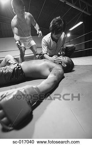 Stock Image - A referee checking Fighters. Fotosearch