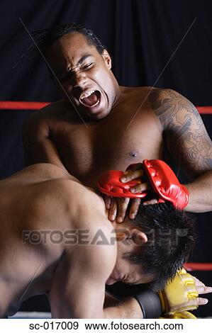 Stock Photo - Mixed Martial Arts Fighter Blocking. Fotosearch