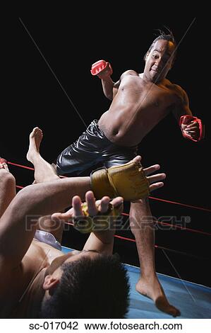 Stock Image - Mixed Martial Arts Fighter Punching. Fotosearch