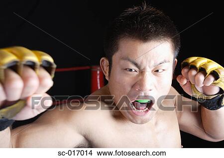 Mixed Martial Arts Fighter With His Defence open View Large Photo Image Picture - Mixed Martial Arts Fighter With His Defence open. Fotosearch
