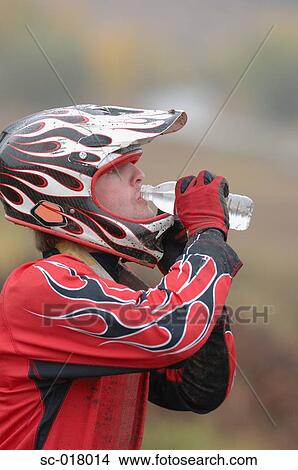 Mountain Biker drinking Water View Large Photo Image Picture - Mountain Biker drinking Water. Fotosearch