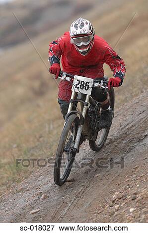 Stock Photo - Mountain Biker Going Downhill. Fotosearch