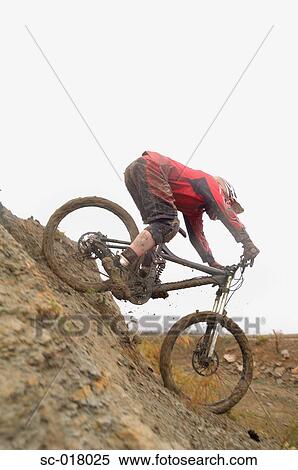 Stock Photography - Mountain Biker Going Downhill. Fotosearch