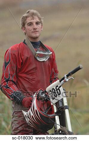 Stock Image - Mountain Biker Taking a Break. Fotosearch
