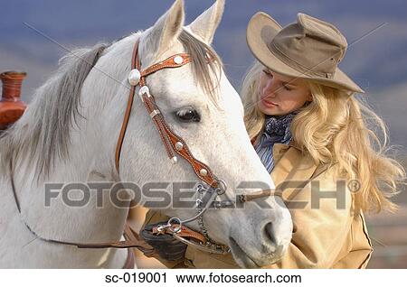 Cowgirl and her Horse View Large Photo Image Stock Image - Cowgirl and her Horse. Fotosearch