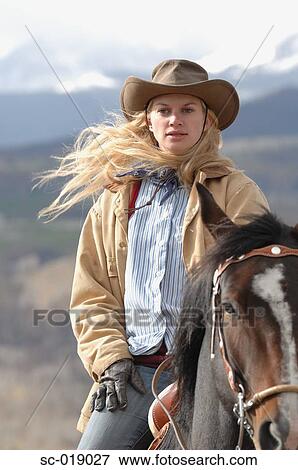 Stock Photo - Cowgirl and her Horse. Fotosearch