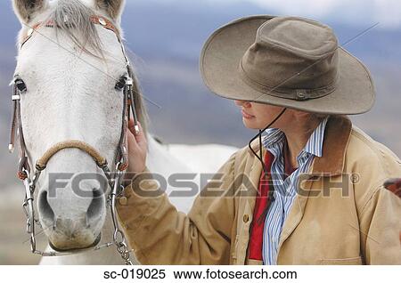 Stock Photography - Cowgirl and her Horse. Fotosearch