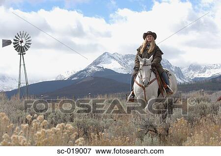 Stock Photo - Cowgirl in the Countryside. Fotosearch