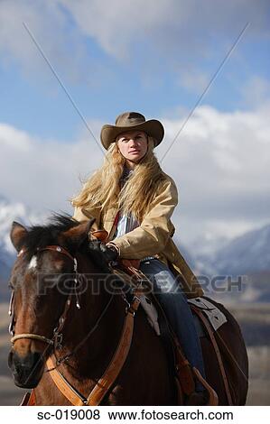 Stock Photo - Cowgirl in the Countryside. Fotosearch