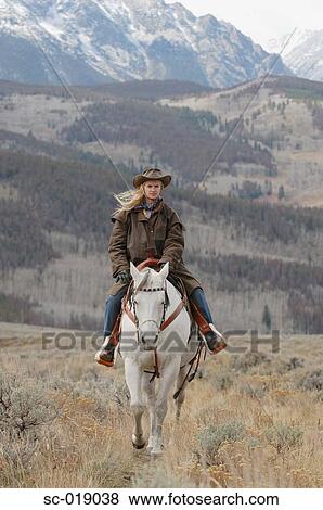 Cowgirl in the Countryside View Large Photo Image Stock Photo - Cowgirl in the Countryside. Fotosearch
