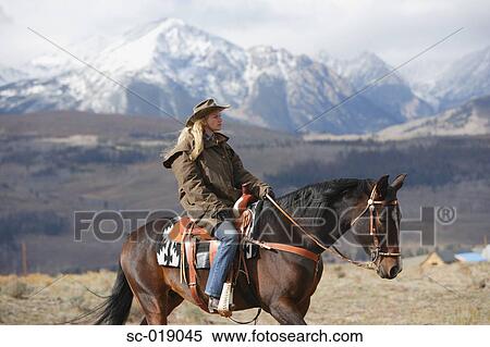 Cowgirl in the Countryside View Large Photo Image Stock Photography - Cowgirl in the Countryside. Fotosearch