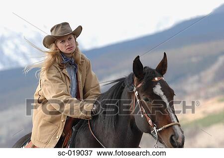 Stock Photo - Cowgirl on a Horse. Fotosearch