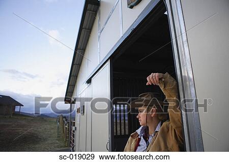 Stock Photo - Pensive Cowgirl. Fotosearch