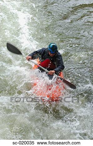 Stock Photography - Kayaker Negotiating the River. Fotosearch