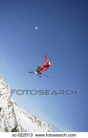 Stock Image - Skier Flying Through the Air. Fotosearch