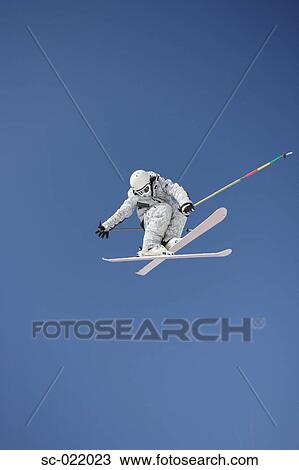 Stock Image - Skier Flying Through the Air. Fotosearch