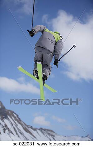 Stock Image - Skier Flying Through the Air. Fotosearch