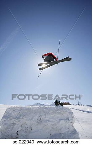 Stock Image - Skier Flying Through the Air. Fotosearch