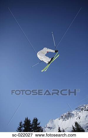 Stock Photo - Skier Flying Through the Air. Fotosearch