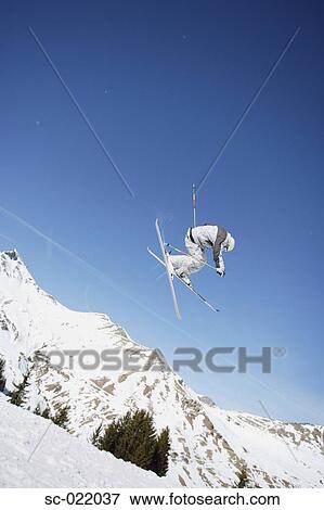 Stock Photo - Skier Flying Through the Air. Fotosearch