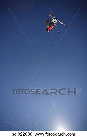 Stock Photograph - Skier Flying Through the Air. Fotosearch