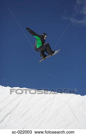 Snowboarder Flying Through the Air View Large Photo Image Stock Image - Snowboarder Flying Through the Air. Fotosearch