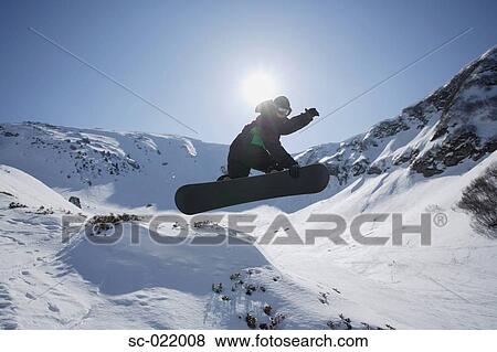 Snowboarder Flying Through the Air View Large Photo Image Stock Photo - Snowboarder Flying Through the Air. Fotosearch