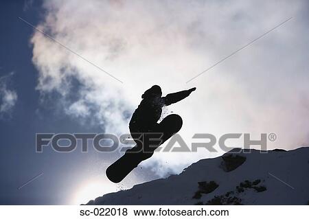Stock Photo - Snowboarder Flying Through the Air. Fotosearch
