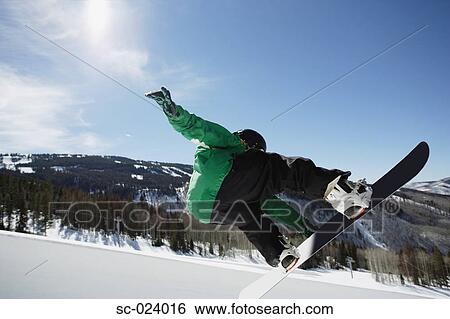 Stock Photograph - Snowboarder Riding a Half Pipe. Fotosearch