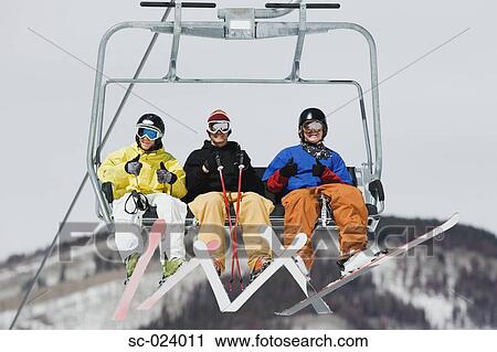 Three Skiers in a Lift View Large Photo Image Stock Image - Three Skiers in a Lift. Fotosearch