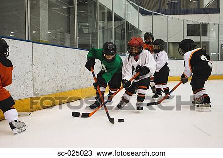 Stock Image - Hockey Players Challenging for the Puck. Fotosearch