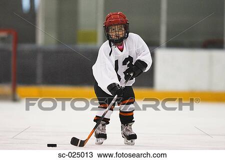 Stock Image - Young Hockey Player. Fotosearch