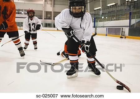 Stock Photo - Young Hockey Player. Fotosearch
