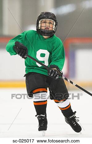 Stock Photo - Young Hockey Player. Fotosearch