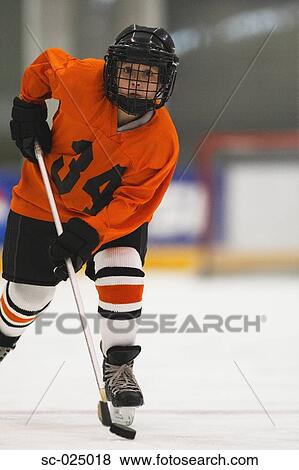 Stock Photo - Young Hockey Player. Fotosearch