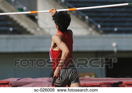 Stock Photo - Athlete Preparing to Jump. Fotosearch