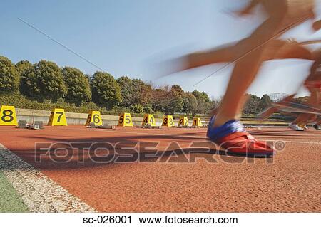 Stock Image - Runners Starting Off. Fotosearch